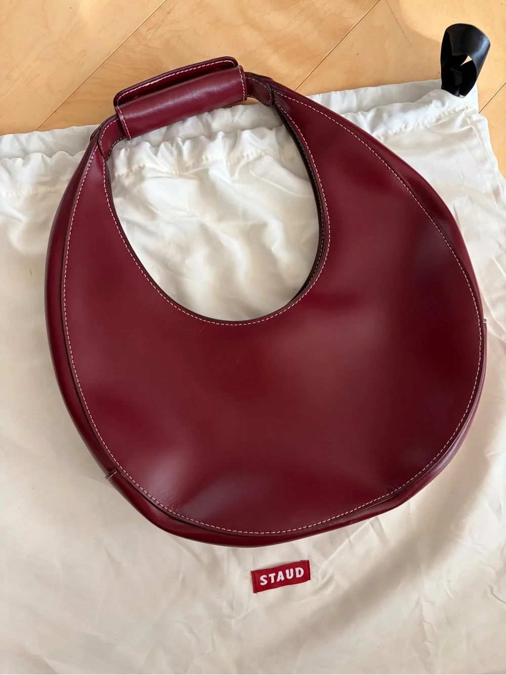 STAUD Crescent Shoulder Bag in Burgundy Red